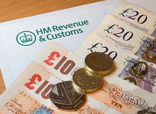 A HMRC (Her Majesty's Revenue and Customs) letter head surrounded by British bank notes and coins.